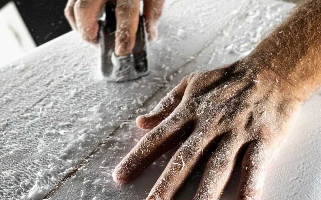 a person with their hand on a piece of paper